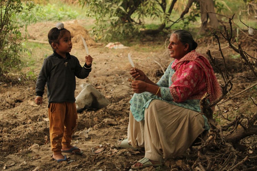 A grandmother and child spending time together outdoors